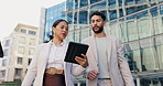 Business people, walking and talking with tablet in city for research, browsing or outdoor networking. Businessman and woman in project discussion, idea or online tasks on technology in an urban town