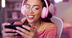 Woman, headphones and smartphone for gaming, streaming for competition and digital world online. Mobile app, connection and esports with technology, internet and entertainment for gamer subscription