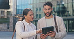 Business people, discussion and talking with tablet in city for research, browsing or outdoor networking. Businessman and woman discussing project, idea or online tasks on technology in an urban town