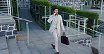 Phone call, walking and business man in city for online chat, b2b networking and discussion. Travel, professional and person on smartphone for conversation, contact and communication on urban commute