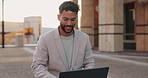 Business man, laptop and typing in street for ideas, writing or report for remote work in metro, sidewalk or city. Person, computer and happy in freelance job with reading for creativity media agency