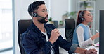 Headset, call center consultant and man in office, workspace and by staff working for support in telemarketing career. Male person, talking and customer service representative with tech for contact