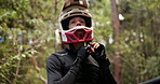 Man, helmet and bike in forest to prepare with safety for journey, race or travel by trees in nature. Person, outdoor and extreme sport with vision in contest, competition and transport in California