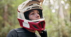 Man, helmet and cycling in forest to prepare with safety for journey, race or travel by trees in nature. Person, outdoor and extreme sport for contest, competition and transport in California woods