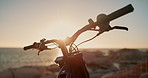 Beach, sky and handlebar or motorcycle for travel, adventure and extreme sport in nature at summer race. Transport, bike or motorbike with ocean, sunset and challenge with power, speed and machine