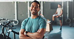 Portrait, gym and smile for male personal trainer, coach and exercise for wellness career. Confidence, face and happy with crossed arms for training instructor, Crossfit and sports in fitness studio 