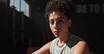 Portrait, serious and woman on break in gym, fitness and exercise for training, practice and sport. Confidence, wellness and female person relax, workout and healthcare for athlete in dark background