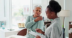 Office, old woman and patient with shoulder pain, consultation and physical therapy with clipboard. Healthcare, professional or client with injury or physiotherapist with client paperwork or wellness