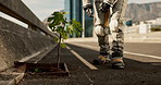 Astronaut, plant and life on planet earth or explore downtown city for new beginnings, discovery or expedition. Person, space suit and walk on urban street with growing nature, adventure or research