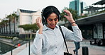 City, business and woman with headphones, dancing and energy with celebration or outdoor listening to radio. Person, employee or entrepreneur with headset or movement with excited or sound with audio