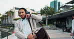 City, business and man with headphones, dancing or excited with energy or listening to radio. Person, employee or consultant with headset or movement with celebration and sound with audio and song