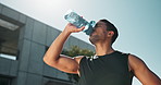 Asian man, city and drinking water for fitness or workout, refreshment and wellness with exercise routine. Male person or athlete, bottle and h2o for hydration or health, tired and thirsty on break.
