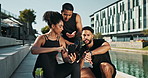 Watch, phone and friends talking, fitness and technology for exercise in city, summer and sports. Outdoor, woman and men, conversation and workout with internet, online and people with mobile