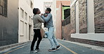 City, conflict and men fight with violence, battle and disagreement with problem, aggression and pushing. Argument, bullying and angry friends in street brawl in urban alley with frustrated danger