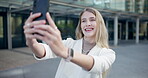 Selfie, business woman and mobile phone in city with confidence, profile picture or photograph. Smartphone, professional and young female for happiness, outdoor and social media post in urban town