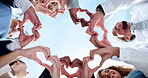 Love, wellness or business people with heart hands, care gesture or sky in community collaboration. Low angle, health or group of employees with teamwork support, symbol or thank you sign outdoors