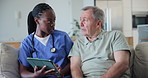 Nurse, senior man and sofa with tablet for talking, report and advice with care, kindness or support for wellness. Caregiver, woman and elderly patient on lounge couch, app or info in retirement home