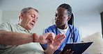 Nurse, senior man and sofa with tablet for consulting, report and advice with talk to show wrist for joint pain. Caregiver, woman and elderly patient on lounge couch, app or info in retirement home