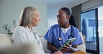 Senior woman, tablet and clinic advice with nurse and cardiovascular consultation. Tech, digital and patient results with hospital feedback with conversation and discussion of health and wellness