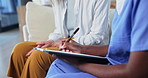 Healthcare, paperwork and nurse with senior woman for consulting, wellness and medical service in home. Retirement, caregiver and person with documents, insurance forms and application for treatment
