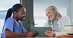 Senior woman, tablet and medical info with happy caregiver with cardiovascular consultation. Tech, digital and nurse with online exam results with conversation and discussion of health and wellness