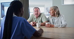 Senior couple, nurse and medical conversation in a hospital for insurance and healthcare advice. Consulting, support and patient in retirement with communication about cancer diagnosis in a clinic