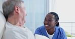 Nurse, patient and happy in bed for good news or results with support, checkup and trust. Closeup, senior man and medical professional with smile for update on health, illness and care in hospital
