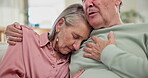 Sad, hug and senior couple with support and empathy for partner with depression in home from cancer. Elderly, man and embrace woman with care, kindness or sympathy for grief in retirement or marriage