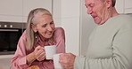 Senior, couple and cheers with coffee or laughing in kitchen for gossip story, retirement and conversation in home. Elderly people, hot beverage or happy by table with joke, wellness or morning break