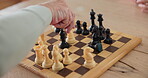 Elderly man, chess and board with hand on knight for contest, problem solving or learning to win. Competition, planning and senior person with game for knowledge, challenge and strategy in retirement