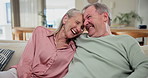Laughing, happy and senior couple on sofa in living room at home with comic, funny or comedy joke. Smile, love and elderly man and woman in retirement relax, bonding and embracing in lounge at house.
