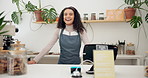 Smile, face and woman barista in coffee shop with positive, good and confident attitude for job. Happy, pride and portrait of young female waitress standing by counter register in cafe or restaurant