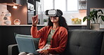 VR, woman and headset on sofa with laptop for interactive metaverse, augmented world or typing. 3D glasses, person or futuristic technology with digital innovation or remote work with virtual reality