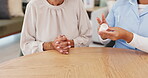 Woman, caregiver or pills in healthcare, support or question of wellness, medicine or product in box. Female pensioner, health worker or container of medicare in pharmaceutical conversation at table