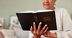 Christian, reading and person with Bible in home for study of religion, faith and learning about God. Gospel, worship and closeup on holy book with spiritual knowledge and history of Jesus Christ