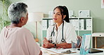 Doctor, diagnosis and shaking hands with woman, greeting or results in wellness clinic. Thank you, welcome with medical worker and patient, discussion and conversation for healthcare prescription
