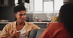 Angry, couple and fight with conflict in breakup, disagreement or argument on sofa at home. Frustrated man or woman shouting for dispute in toxic relationship, divorce or cheating affair at the house