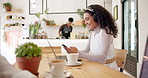 Headphones, laptop and woman with phone in coffee shop networking on social media or internet. Technology, smile and female creative freelancer type email on cellphone and working on computer in cafe