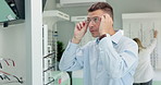 Man, choice and mirror with glasses for optometry or vision and happy for shopping decision in store. Male person, eye health and selection for prescription, spectacles and eyewear for eyesight.