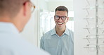 Mirror, man and glasses with optometry, customer and choice with eye care and optical wellness. Person, client and guy with reflection and vision check with stylish lens frame and store with retail
