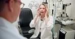 Optometrist, patient and consultation for eye care in clinic with talking, symptoms and equipment. Female person, doctor and consulting with listening, advice and treatment for healthcare or wellness