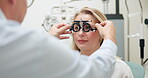 Ophthalmologist, woman and test frame for vision, healthcare or wellness in consultation for eye care. Medical exam, optometry and patient on lens for check up or trial with hands of doctor in clinic