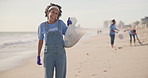 Beach, volunteer or happy woman with plastic bag for sustainability, help or ocean cleaning project. Accountability, portrait and volunteer at sea for earth day, social responsibility or NGO charity