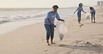 Volunteer, beach and trash cleaning with teamwork for community service or pollution, plastic or waste management. Women, climate change and nature ocean for recycling, global warming or environment