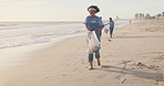 Volunteer, beach or people with plastic bag in nature for sustainability, help or ocean cleaning project. Accountability, team or volunteer at sea for earth day, social responsibility or NGO charity