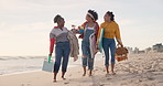 Happy, holiday and friends at beach for picnic or walking together in summer on vacation in Brazil. Women, chat and group relax on sand with basket of food and travel to ocean or sea for adventure