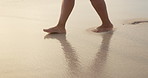 Feet, legs and walk on beach sand with travel, vacation on tropical island with ocean for peace and calm. Footprint, journey and adventure outdoor, waves and sea shore with tourism and zen for summer