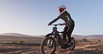 Motorbike, speed and man on sand trail with motorcross, power and rider outdoors. Driver, motorcycle and male person travel or riding on dirt track, performance and action or talent for freedom
