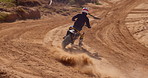 Bike, sports and off road training with person on dirt track for adrenaline, competition or speed. Athlete, biker and professional in race, challenge and motorcycle for training, exercise and fitness