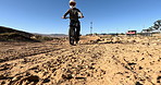 Bike, dirt and tyres with sports person on off road course for competition, performance or race. Motorcycle, training and wheels with athlete rider on vehicle for adventure, adrenaline or power